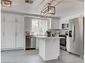 Updated kitchen featuring white cabinets and a center island at 2384 Wild Ginger Ln, Las Vegas, NV 89134