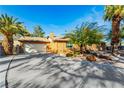 Side view of single-story home with garage at 3045 Lindell Rd, Las Vegas, NV 89146