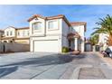 Two-story house with attached garage and landscaped front yard at 8346 Canvas Ct, Las Vegas, NV 89113