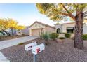 Front view of a house with two mailboxes and gravel driveway at 2247 Sun Cliffs St, Las Vegas, NV 89134