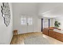 Bright entryway with double doors and a stylish circular mirror at 4330 Flandes St, Las Vegas, NV 89121