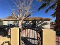 House with front yard, mature tree, and gated entry at 4752 Livermore Ave, Las Vegas, NV 89120