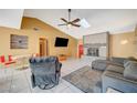 Bright living room with tile floors and a sectional sofa at 5152 Tennis Ct # E, Las Vegas, NV 89120