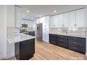 Modern kitchen with white and dark cabinetry, quartz countertops, and stainless steel appliances at 2914 Congress Ave, Las Vegas, NV 89121