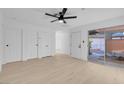 Living room featuring light wood floors and sliding glass doors at 413 N Lamb Blvd # H, Las Vegas, NV 89110