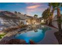 Inviting pool and spa surrounded by a lush backyard at 2111 Alberti Ct, Las Vegas, NV 89117