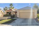 Single-story house with attached garage and desert landscaping at 309 Wild Plum Ln, Las Vegas, NV 89107