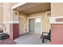 Private patio with sliding glass door access and seating at 5855 Valley Dr # 1103, North Las Vegas, NV 89031