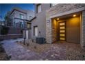 Contemporary home exterior with stone accents and walkway at 600 N Carriage Hill Dr # 1164, Las Vegas, NV 89138