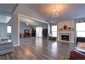 Spacious living room with hardwood floors and a fireplace at 1204 Smith St, Las Vegas, NV 89108