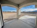 Covered patio with views of the desert landscape at 2800 Wisteria Way, Pahrump, NV 89048