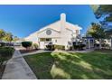 Townhouse exterior with walkway and green lawn at 8949 Clairton Ct, Las Vegas, NV 89117