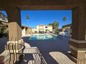 Community pool with surrounding patio furniture at 3613 Shawn Reynolds Ct # 204, Las Vegas, NV 89129