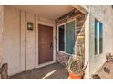 House entrance with a brown door and stone accents at 4200 Tolkien Ave, Las Vegas, NV 89115