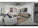 Bright living room with comfortable seating and a large TV at 855 Apatite Pl # Lot 50, Henderson, NV 89011