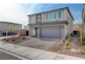 Two-story home with stone exterior and landscaped yard at 8731 Black Cordon Rd, Las Vegas, NV 89139