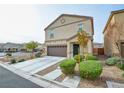 Two-story house with brown garage door and landscaping at 4959 Quest Tribe St, Las Vegas, NV 89122