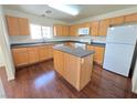 Modern kitchen featuring an island and hardwood floors at 9013 Progressive Ct, Las Vegas, NV 89149