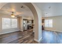 Open dining area with wood-look flooring and kitchen views at 911 Rifle Dr, Henderson, NV 89002