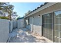 Private patio with sliding glass doors and access to storage at 2036 Willowbury Dr # D, Las Vegas, NV 89108