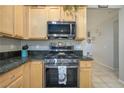 Kitchen features gas range and stainless steel microwave at 2429 Great Auk Ave, North Las Vegas, NV 89084