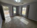 Bright living room with neutral walls and large windows at 254 W Virginia Ave, Overton, NV 89040