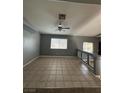 Open living area with tile floors and a ceiling fan at 4900 Quinlan Ave, Las Vegas, NV 89130