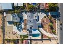 An aerial view of a home with a pool, landscaping, and solar panels at 6235 Eldora Ave, Las Vegas, NV 89146