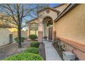 Landscaped front yard with walkway to entryway at 8217 Quail Arroyo Ave, Las Vegas, NV 89131