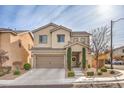 Two-story home with a two-car garage and landscaped front yard at 9113 Sea Mink Ave, Las Vegas, NV 89149