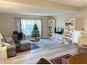 Spacious living room featuring a Christmas tree and built-in shelving at , Las Vegas, NV 89147