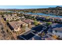 Lakefront homes with solar panels and beautiful landscaping at 102 Appia Pl, Henderson, NV 89011