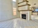 Living room featuring a fireplace and tile flooring at 1565 Pasture Ln, Las Vegas, NV 89110