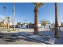 Modern single-story home with palm trees and a two-car garage at 5600 Topaz St, Las Vegas, NV 89120