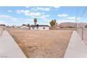 Spacious backyard with gravel and walkways, enclosed by a fence at 5731 Hazen Ct, Las Vegas, NV 89110