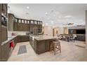 Spacious kitchen with island, stainless steel appliances and views into Gathering room at 10758 Chillingham Dr, Las Vegas, NV 89183