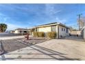 House exterior with a landscaped front yard at 2812 Perliter Ave, North Las Vegas, NV 89030