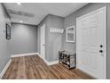 Entryway with gray walls, wood-look flooring, coat rack, and a shoe organizer at 2936 Brady Ave, Las Vegas, NV 89101