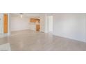 Open living area with wood-look tile flooring and white walls at 3450 Erva St # 165, Las Vegas, NV 89117