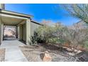 Landscaped side yard with covered walkway and shed at 5020 Pioneer Scout St, North Las Vegas, NV 89031