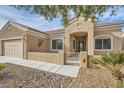 One-story house featuring a welcoming front porch and neutral exterior at 7629 Homing Pigeon St, North Las Vegas, NV 89084