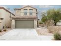 Two-story house with a two-car garage and desert landscaping at 3325 Edinboro Ridge Ave, North Las Vegas, NV 89081