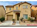 Front exterior of a two-story home with a driveway, attached garage, and shrubs at 8381 Transvaal Blue St, Las Vegas, NV 89139