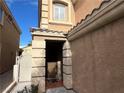 Front entry with a covered porch and tiled walkway at 172 Tall Ruff Dr, Las Vegas, NV 89148