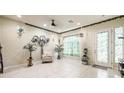 Living room with tiled floors, a sitting area and a door leading outside at 10042 Pipestone St, Las Vegas, NV 89141