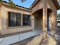 Front door with security gate and covered entryway at 2041 Hussium Hills St # 108, Las Vegas, NV 89108