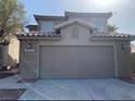 Front view of a two-story home with a two-car garage at 4454 Bertram Ln, Las Vegas, NV 89147