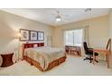 Cozy bedroom with a comfortable bed and built-in workspace at 2142 Oliver Springs St, Henderson, NV 89052