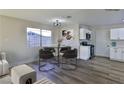 Charming dining area with a round table and four gold chairs at 3225 Crawford St, North Las Vegas, NV 89030