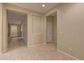 The entryway with tile flooring and a view down the hallway at 8904 Martin Downs Pl, Las Vegas, NV 89131